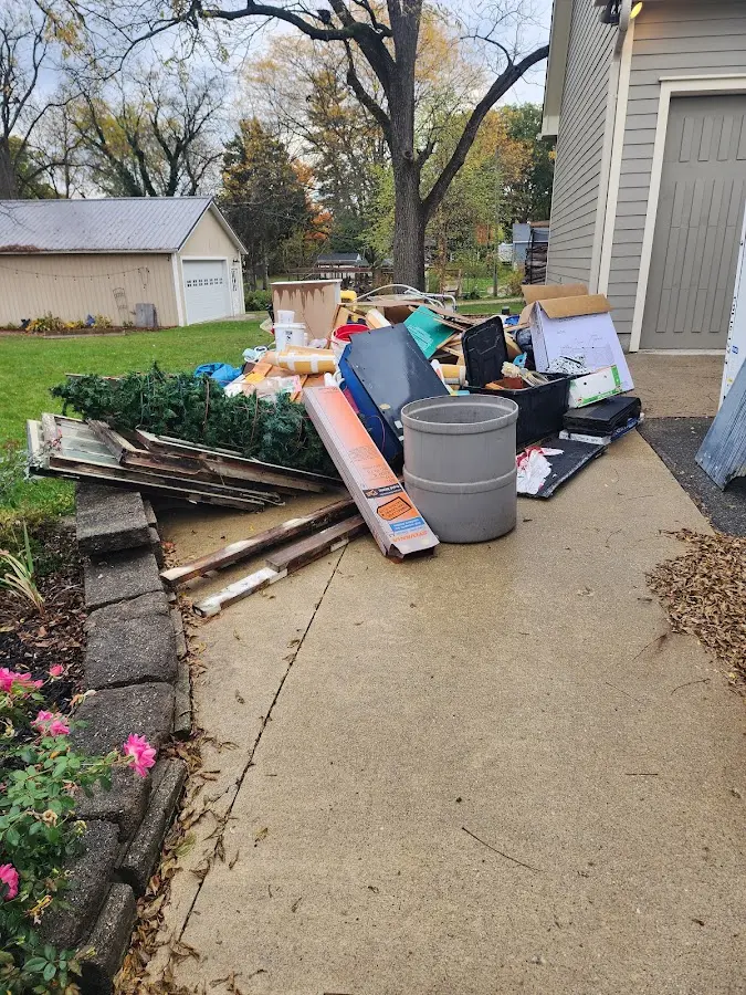 Dumpster being loaded with debris for Roofing Dumpster Rental in Westtown